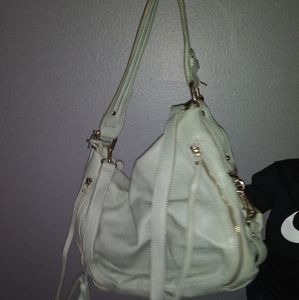 Large shoulder bag with multiple pockets and zippe